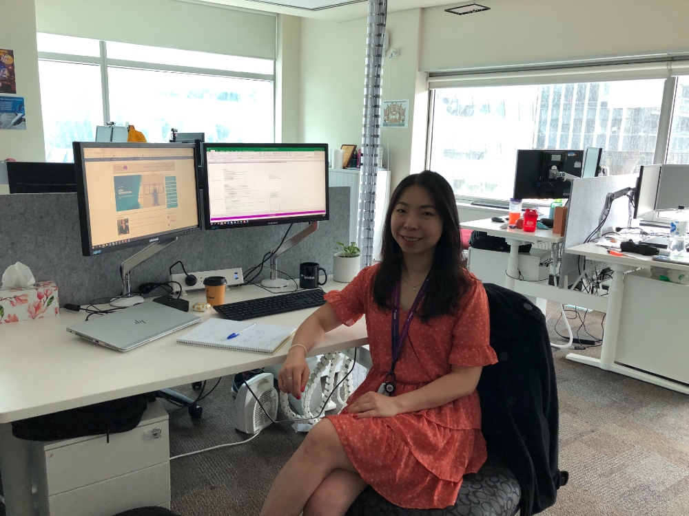 Yanny Li working on desk