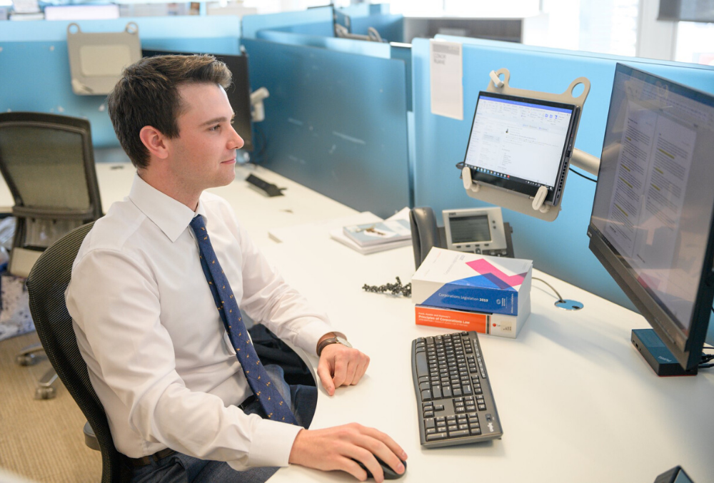 Conor at his desk in the office