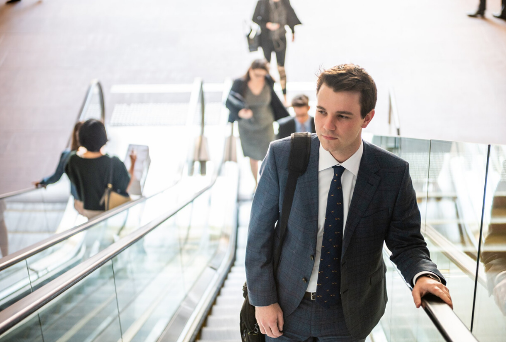 Conor on an escalator heading to work