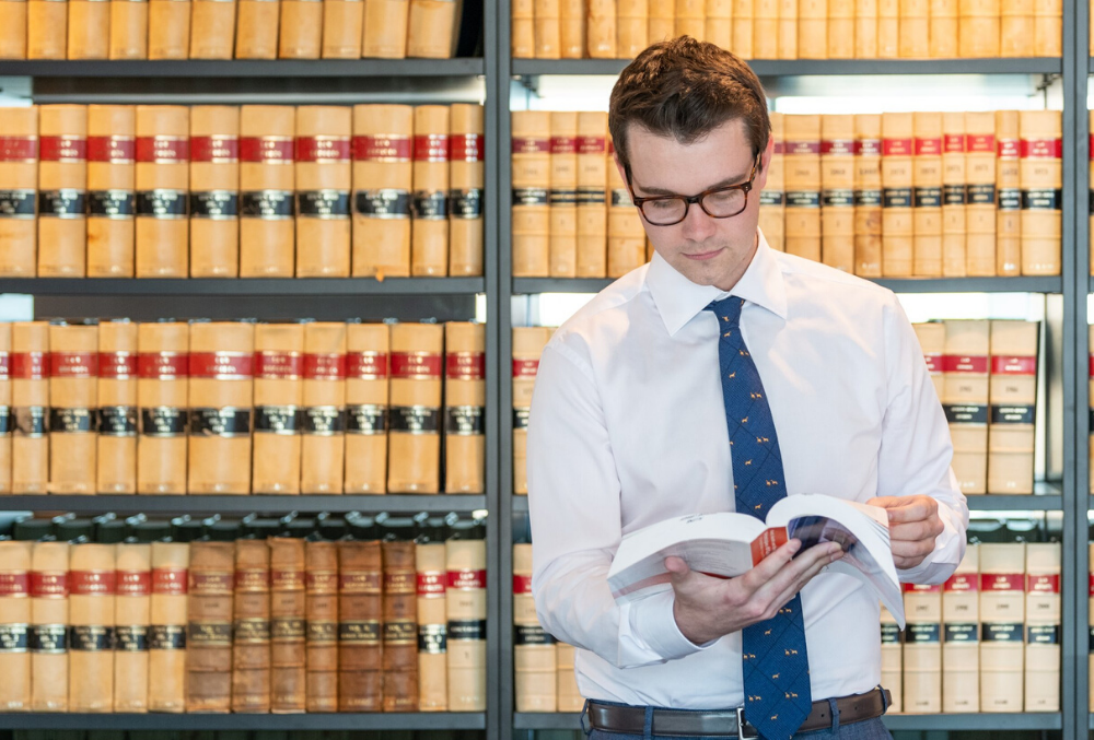 Conor doing research at the library