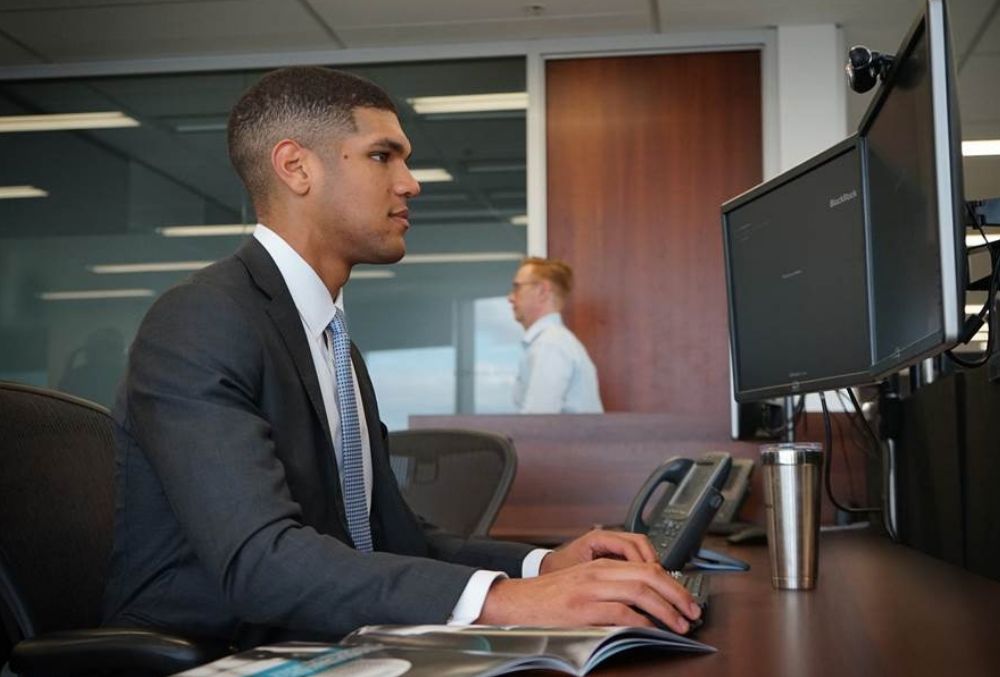 BlackRock Obi Mbakwe at his desk