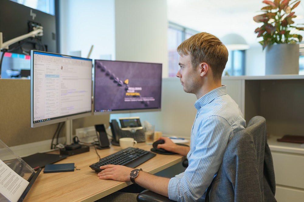 Lachlan working at his desk