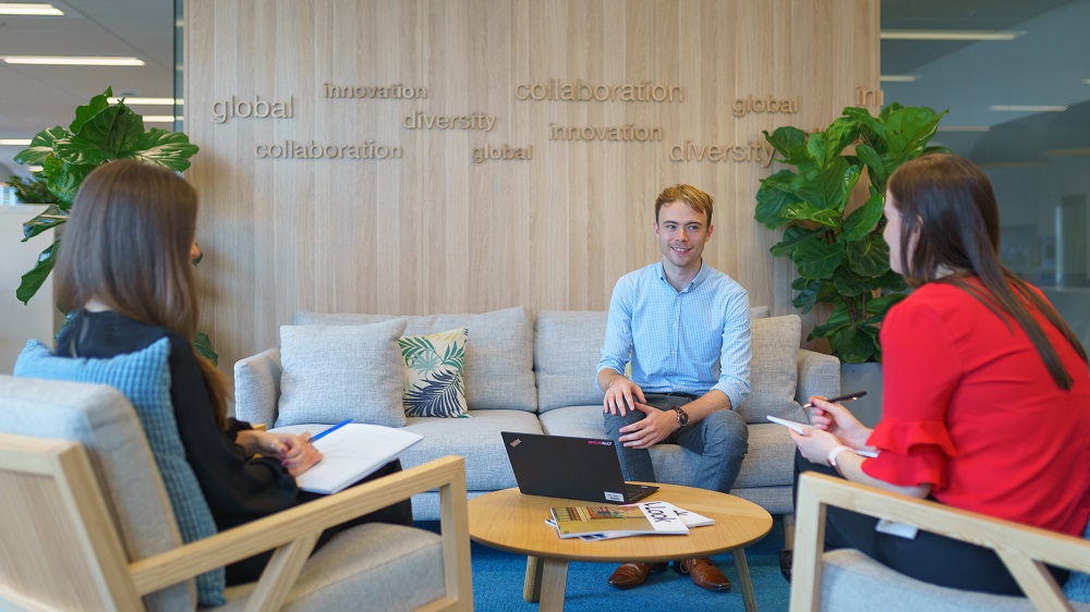 Lachlan catching up with colleagues