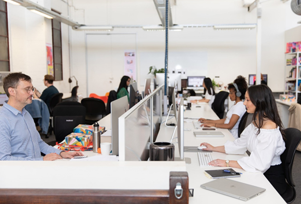 Mecca Brands Graduate - Janey Nestadt at her desk