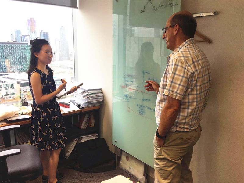 Pitcher Partners Yingchao Ma discussing GST queries with her colleague