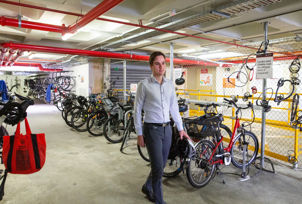 Josh getting on a bike to work