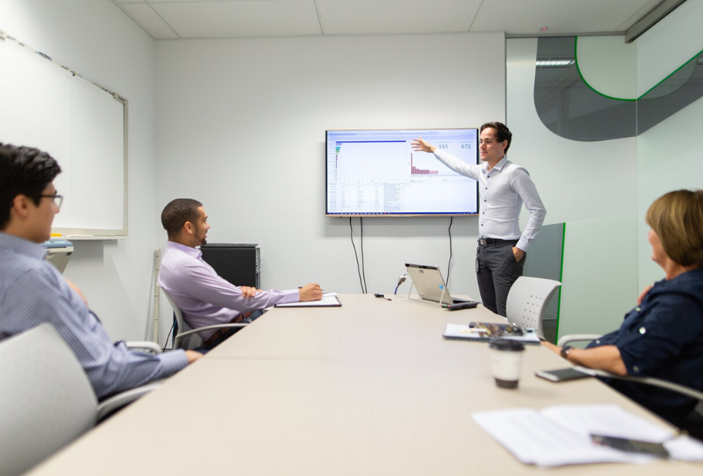 Josh presenting statistics to his team