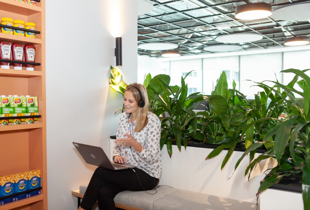 Kraft Heinz Graduate- Young executive having a virtual meeting with a colleague.