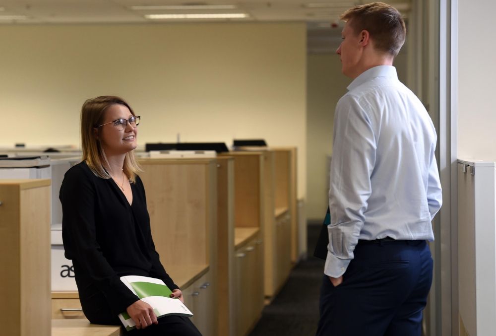 Day-in-the-life-Ashurst-Jessica-conferring-with-a-partner-on-a-case