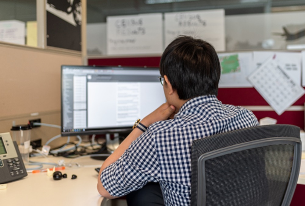 <DEPARTMENT OF EDUCATION> <GRADUATE> - <Young professional male sitting at a desk>