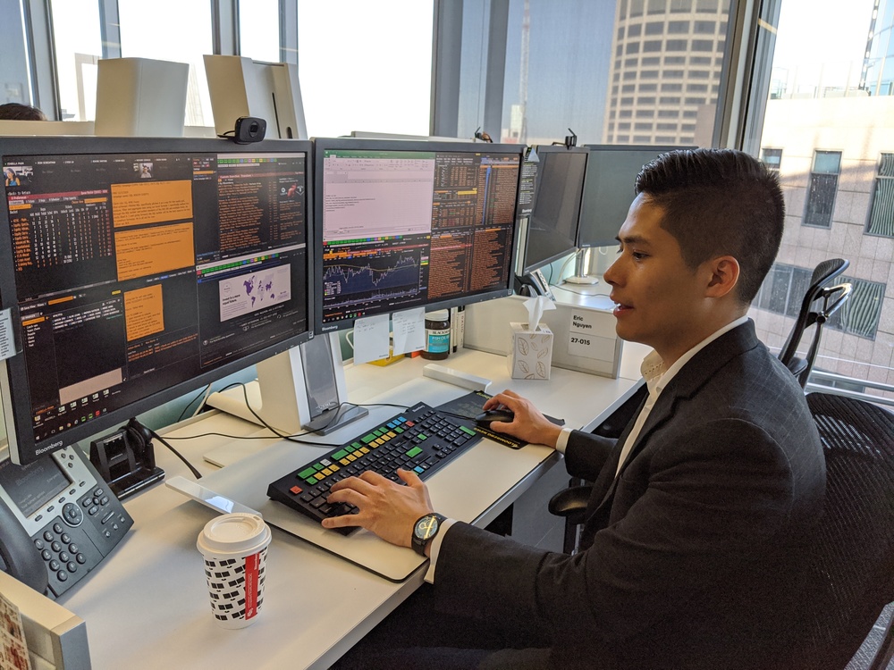 A young professional at his office desk