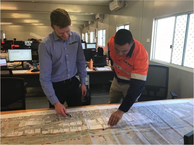 Two professionals discussing construction programs in the office 