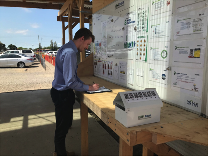 A young professional drafting his plans on site