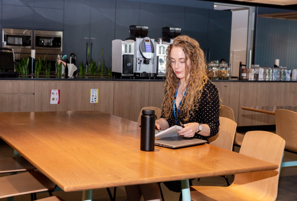 WSP Graduate- A young female professional preparing for a meeting.