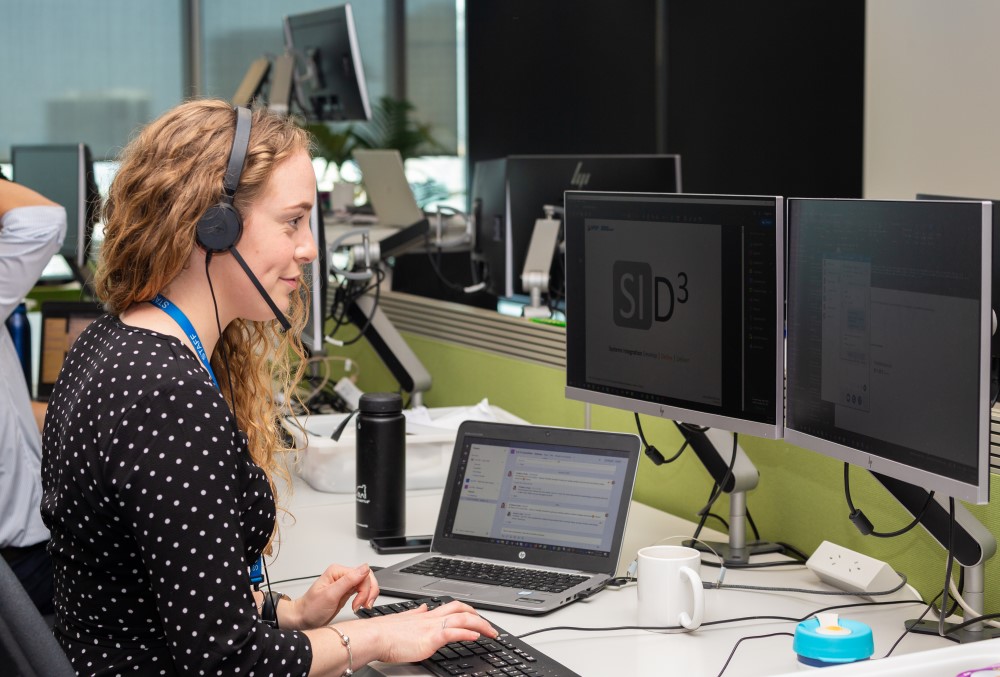 WSP Graduate- A young female professional talking to someone over the phone.