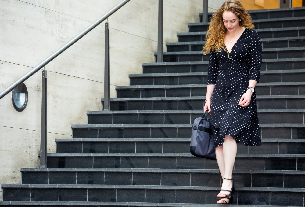 WSP Graduate- A young female professional heading out of the office.