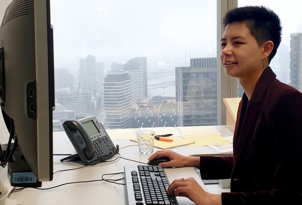 AGD Graduate - Young female lawyer working at her desk.