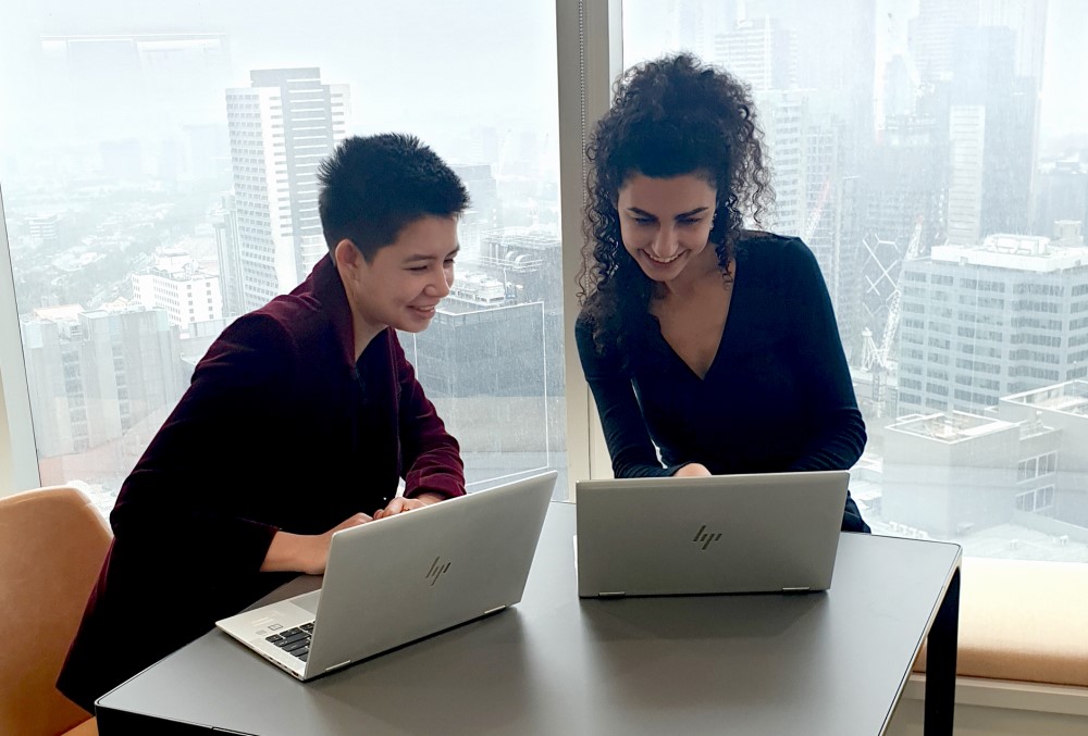 AGD Graduate - Two young professionals having meeting.
