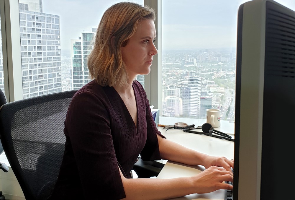 AGD Graduate - Young female lawyer working on her laptop.