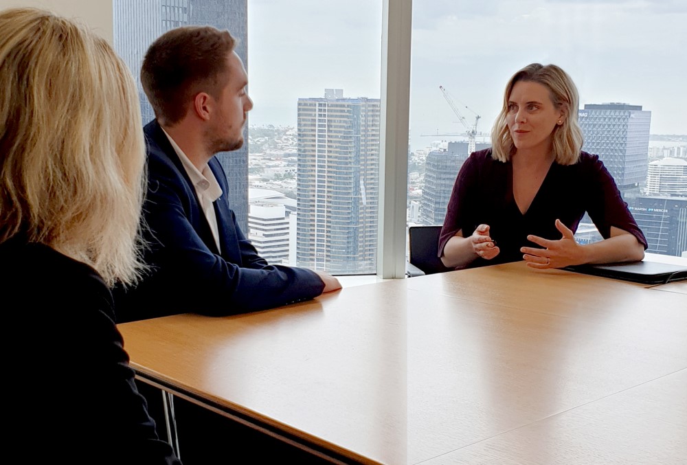 AGD Graduate - Young female lawyer having a seminar with her colleagues.