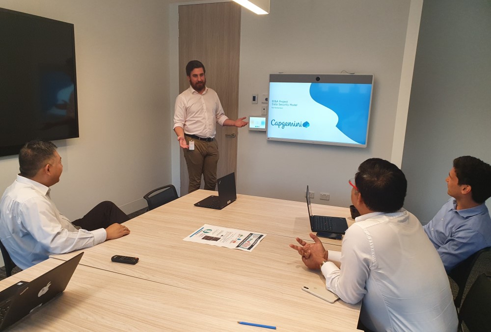 Capgemini Australia Graduate - Male professionals having a meeting.