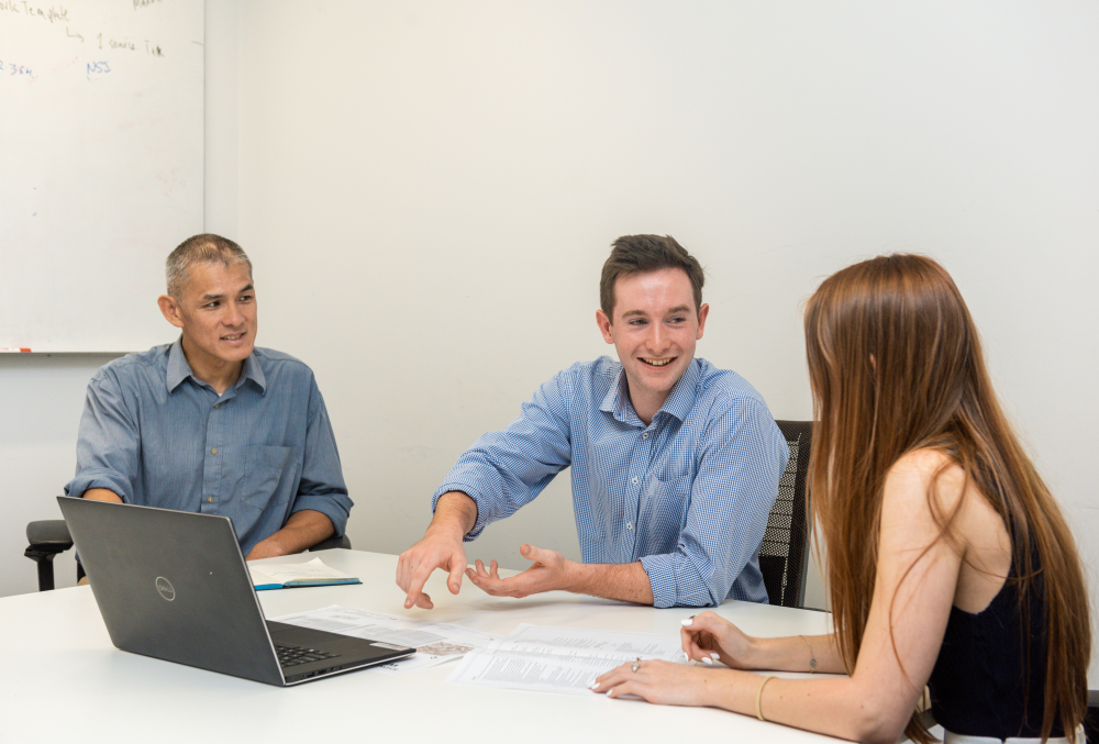 Downer Graduate- Young male professional having a bid meeting.