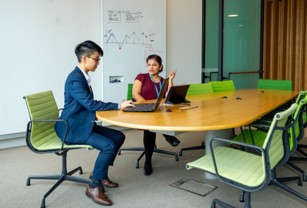 The Data School Graduate - Two female professionals on a meeting.