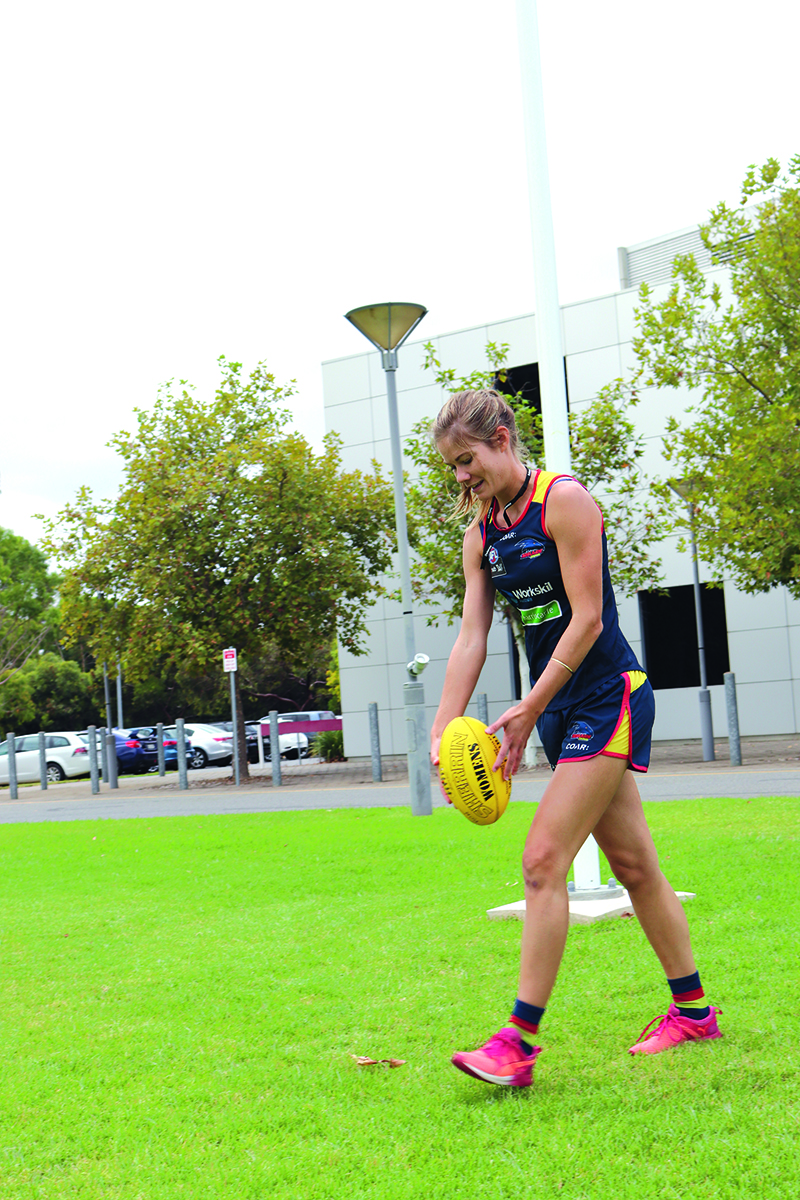 Monique playing AFL